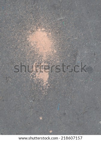 bright pink paint on a dark gray asphalt