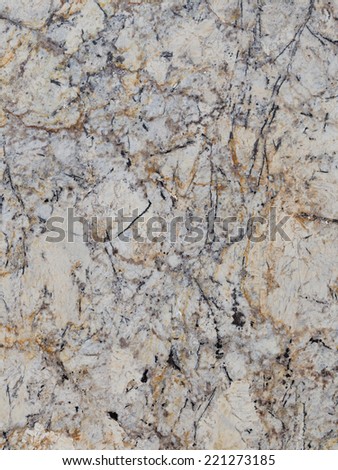 large granite slab of brown gray black beige stone