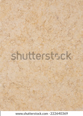 solid smooth beige marble with brown stripes and yellow spots