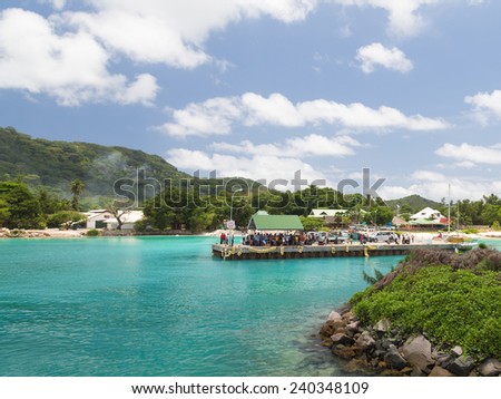 La Digue - November 3, 2014: A lot of people are waiting for the ferry in the port of November 3, 2014, La Digue, Seychelles