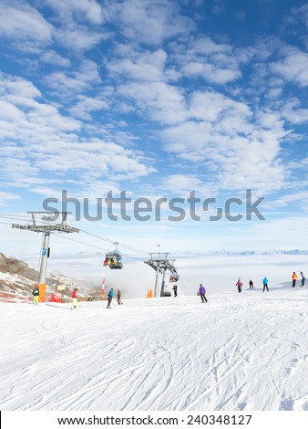 Zell am See - Kaprun - December 6, 2014: People skiing and snowboarding at the ski resort of Kaprun glacier Kitssteynhorn - December 6, 2014, Zell am Cee - Kaprun, Austria