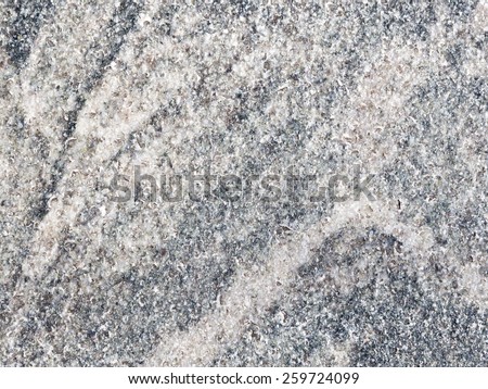 natural mottled gray granite with dark streaks, patches of pink and light spots