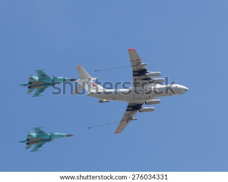 Moscow - May 7th, 2015: Military planes mimic pair aerial refueling over Red Square  of blue sky May 7, 2015, Moscow, Russia