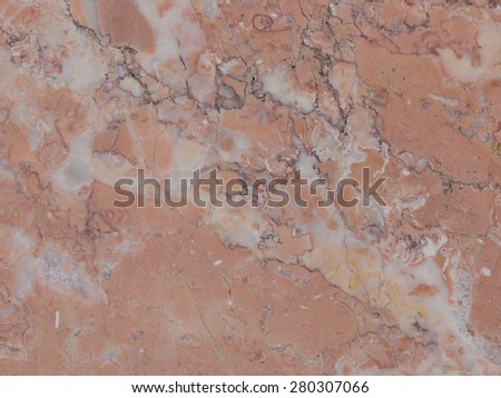 beautiful pink marble texture of natural stone with small patches of light and dark streaks