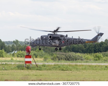 Moscow Region - June 17, 2015: Landing a powerful impact military helicopter Mi-35 demonstrations at air shows in Kubinka June 17, 2015 Moscow region, Russia
