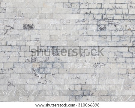 big old wall lined with beautiful gray marble with beautiful colorful streaks