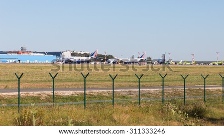Moscow - August 6, 2015: Cargo terminal, control tower and planes at Domodedovo airport and runway August 6, 2015, Moscow, Russia