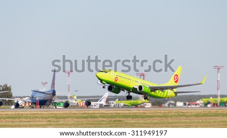 Moscow - August 6, 2015: Green Airliner Boeing 737-8GJ S7 Airlines, tail number VQ-BVK takes off at Domodedovo airport and on the background of bright blue sky on Aug. 6, 2015, Moscow, Russia