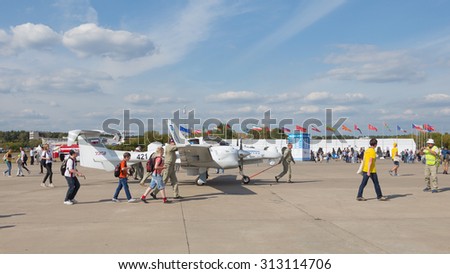 The Moscow region - August 28 2015: Pilots of small aircraft carrying UZGA RTI aerospace systems at the international air show Max and many people August 28, 2015, Zhukovsky, Moscow Region, Russia