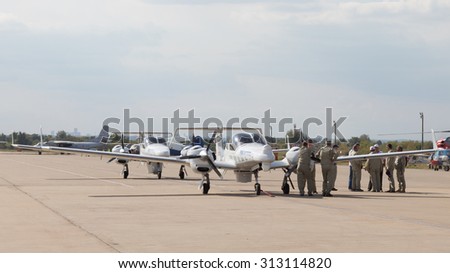 The Moscow region - August 28 2015: Pilots and mechanics have a small plane UZGA RTI aerospace systems in the international air show Max  August 28, 2015, Zhukovsky, Moscow Region, Russia