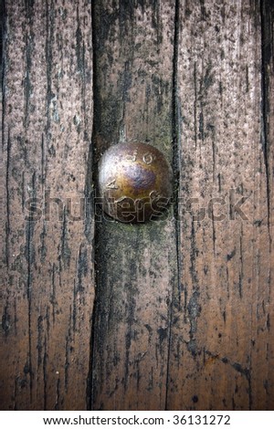 weird wooden surface with bolt / abstract dirty grunge background /