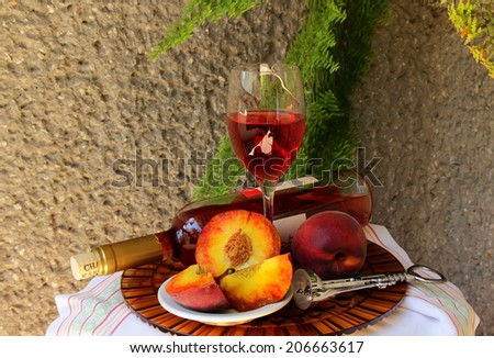 Still life with bottle  of wine,  glass of wine and peaches
