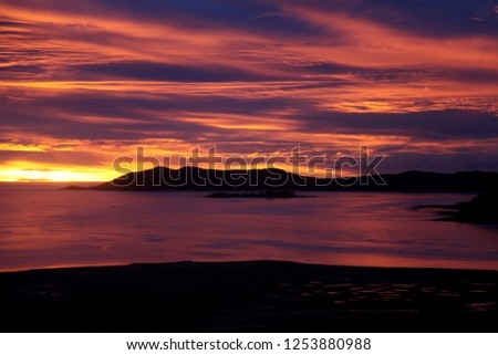 Image, Stock Photo Sunset on Thursday Island. In the golden glow, the water shines. In front a group of trees and behind a small island with passage to the sea.