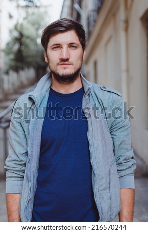 young man posing in the street