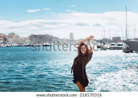 young girl posing in the port