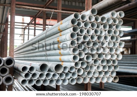 Group of Stack of iron pipes in an iron shop