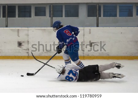 BELGRADE,SERBIA-NOVEMBER 24:Unidentified ice hockey players in action with puck at 