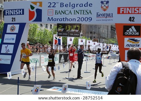 BELGRADE – APRIL 18: Winner Kigen Victor Kiplagat (No. 5) of Kenya raises his hands at finish line at 22nd Belgrade Marathon April 18, 2009 in Belgrade. Kiplagat finished with 2 hours 13 mins 28 secs.