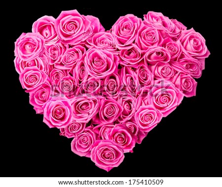 Heart made of pink rose blooms isolated on black