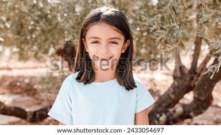 Similar – Image, Stock Photo Toothless girl smiling for camera