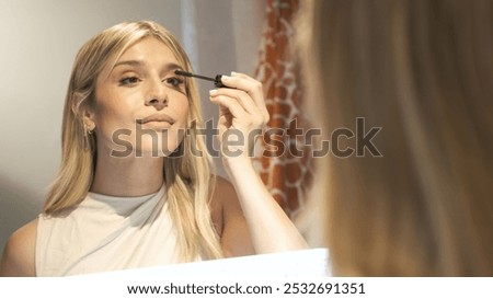 Similar – Image, Stock Photo Crop woman doing makeup in studio