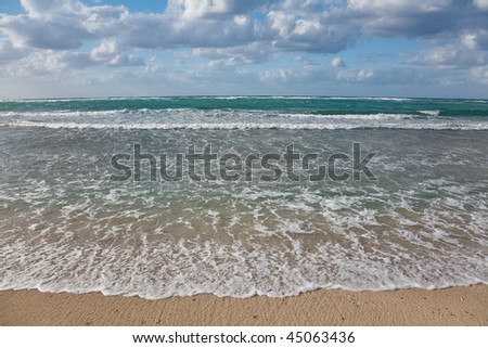 Caribbean seascape  - gentle waves touching the beach, Jibacoa, Cuba