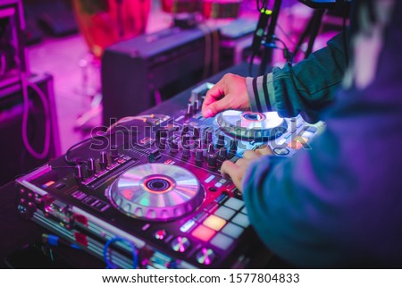 DJ mix tracks at nightclubs at parties, best DJ play, famous CD players at nightclubs during the EDM party, party ideas Сток-фото © 