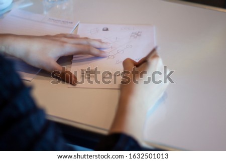 Similar – Image, Stock Photo Unrecognized person passing a marijuana joint to his friend during a party.