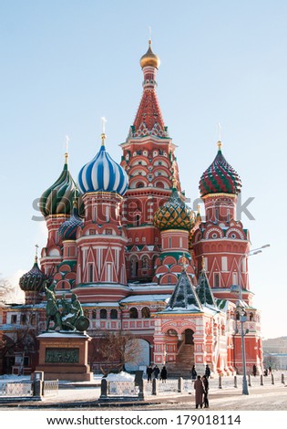 MOSCOW, RUSSIA - JANUARY 20, 2014: St Basil\'s Cathedral and monument to Minin and Pozharsky on Red Square in Moscow. St. Basil\'s Cathedral was built in 1555-1561 years by order of Ivan the Terrible
