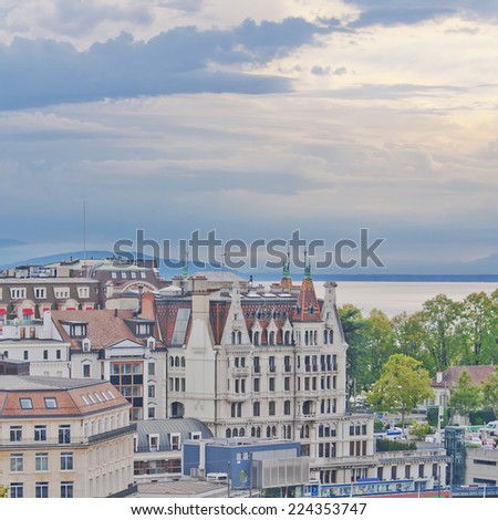Skyline of Lausanne, Switzerland as seen from the Cathedral hill. Lake Leman (Lake Geneva) and the French Alps provide a beautiful background.