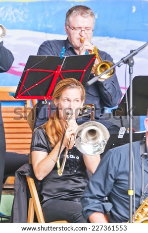 MONTREUX, SWITZERLAND - SEPTEMBER 21, 2014: Musicians big band Tonis play on the street scene town Montreux. The big band Tonis - famous Swiss jazz band