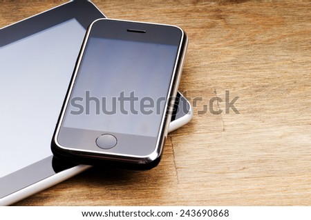 modern computer gadgets - tablet and phone close up