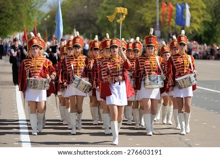 Orel, Russia - May 09, 2015: Celebration of the 70th anniversary of the Victory Day (WWII). Drummers girls in red uniform marching in parade