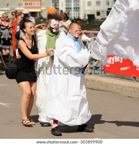 Orel, Russia, August 01, 2015: Mumu Fest, Turgenev\'s story art-festival, mimes, pantomime, clowns dancing with girl