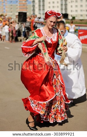 Orel, Russia, August 01, 2015: Mumu Fest, Turgenev\'s story art-festival, mimes and actor in red dress dancing