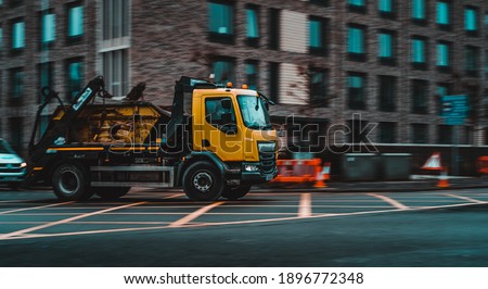 Similar – Image, Stock Photo moving yellow dumpster in front of a red brick wall