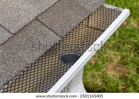 Similar – Image, Stock Photo Rain falls on a small solar panel behind a street lamp in a small alley