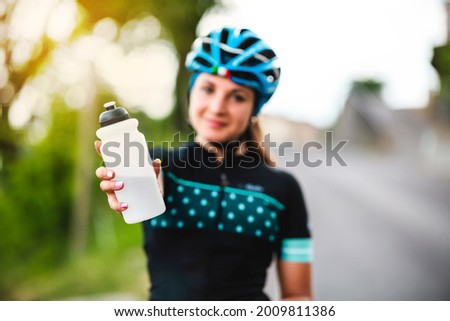 Similar – Image, Stock Photo Positive female cyclist resting on street