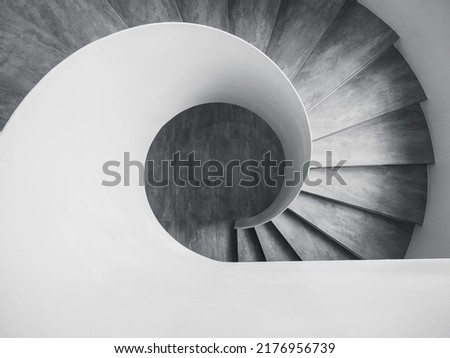 Similar – Image, Stock Photo Spiral staircase in the evening sun and mirrored in a glass façade