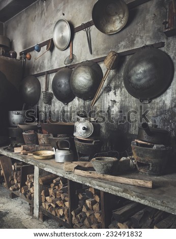 Traditional Asian style Kitchen interior with wok stove fire wood old and dirty.