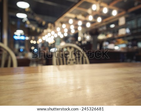 Top of Wood Table with Bar Restaurant blurred background