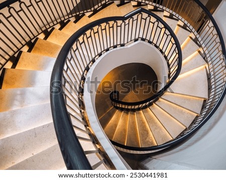 Similar – Image, Stock Photo Spiral staircase in the evening sun and mirrored in a glass façade