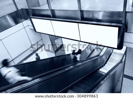 Blank Banner Billboard Display with escalator and people in subway station