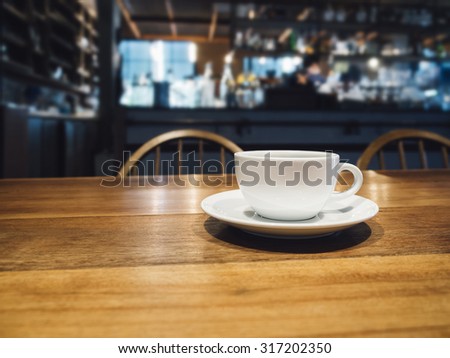 Coffee cup on table in Bar Restaurant Cafe Background