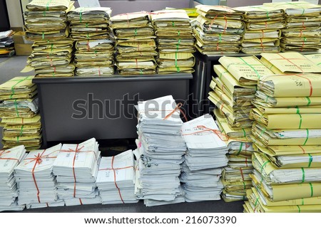 Stack Of Tied Old Files And Documents Yellowing On Office Floor