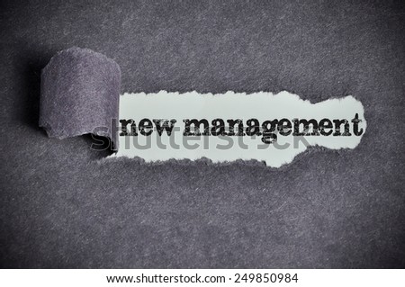 new management word under torn black sugar paper