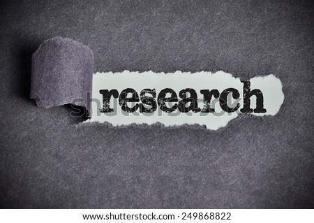 research word under torn black sugar paper