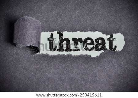 threat word under torn black sugar paper