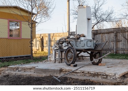 Similar – Image, Stock Photo An old rusty wheelbarrow with a fat black balloon tyre tries to hide in a lilac bush, but doesn’t quite succeed