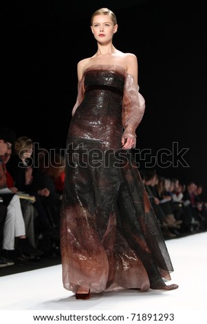 NEW YORK - FEBRUARY 14: Top Model Frida Gustavsson walks the runway at the Carolina Herrera Fall 2011 Collection presentation during Mercedes-Benz Fashion Week on February 14, 2011 in New York.